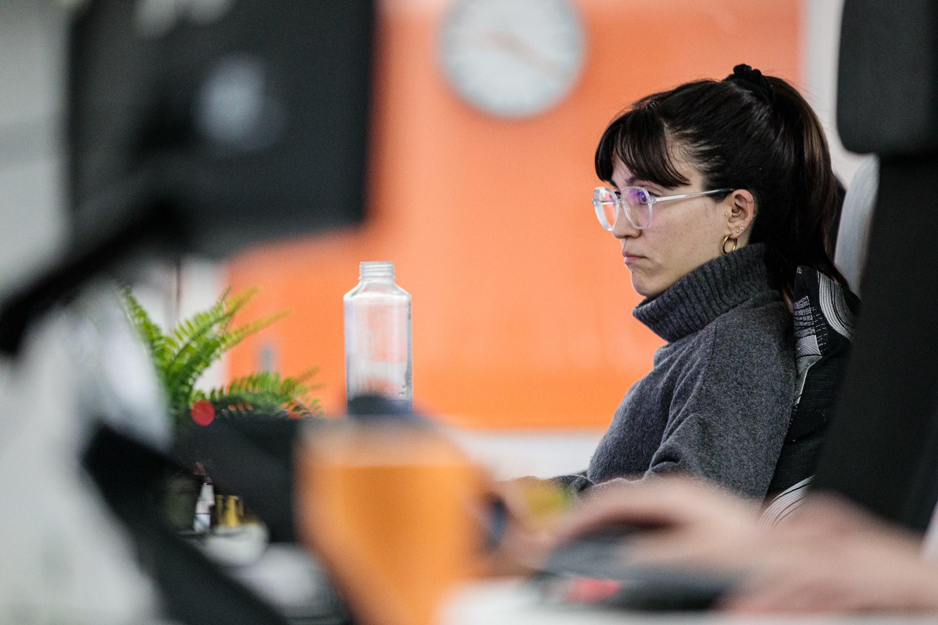 A website designer concentrating on her computer