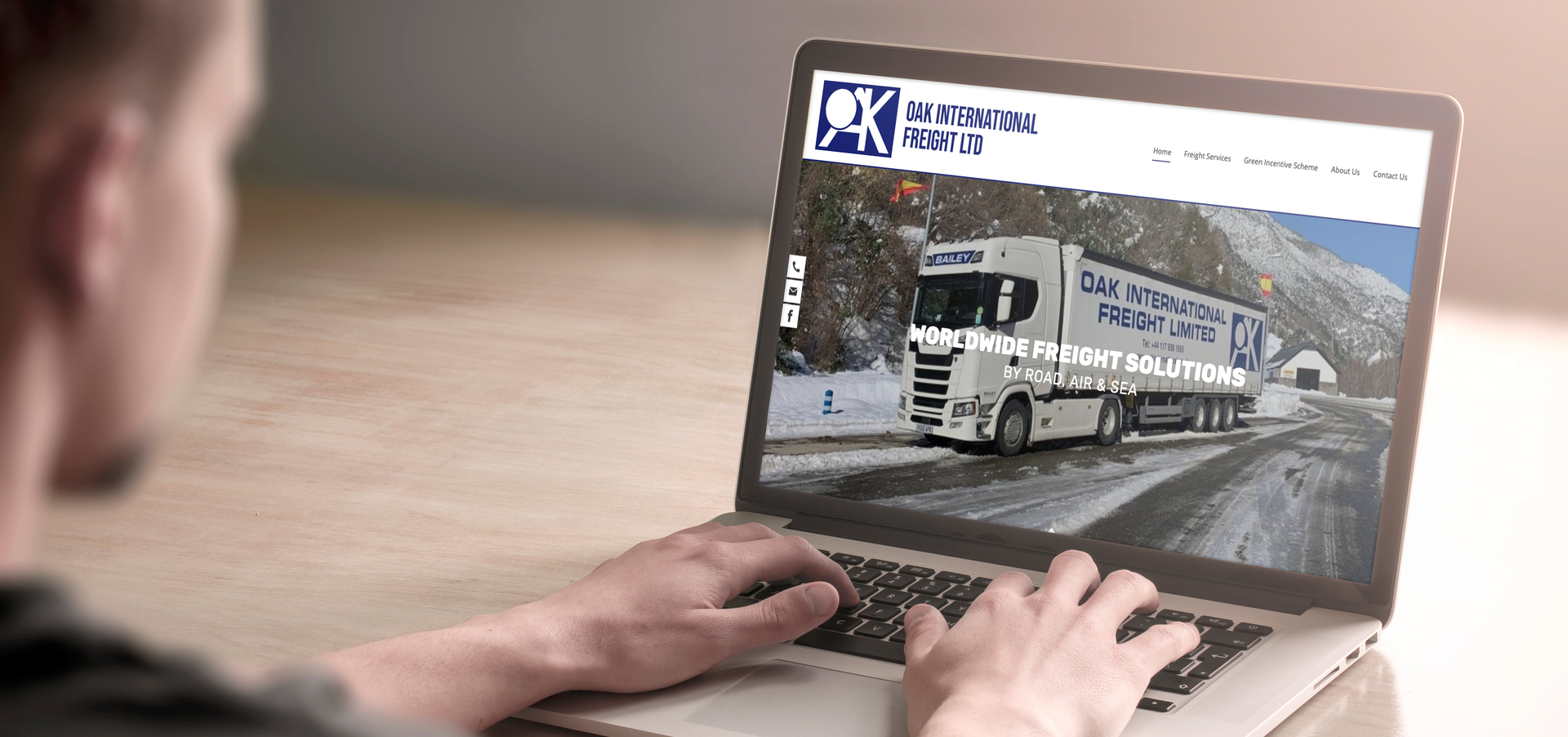 Oak International Freight Ltd on a laptop