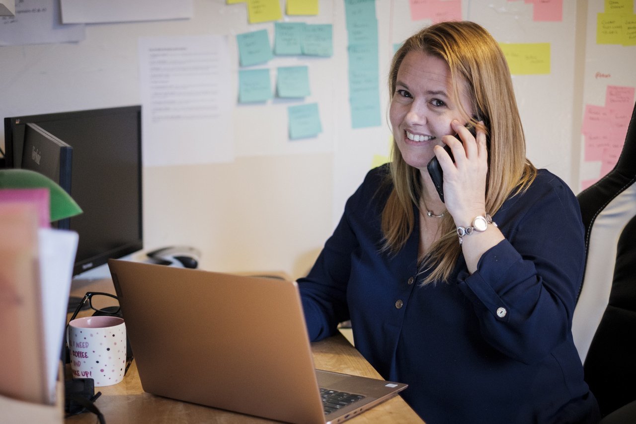 Your Bristol web consultant holding a phone to her ear